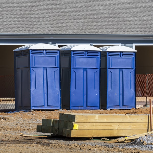 what is the cost difference between standard and deluxe portable restroom rentals in Harvey